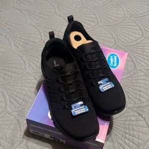 Skechers Woman’s Black Knit Slip-On Sneakers